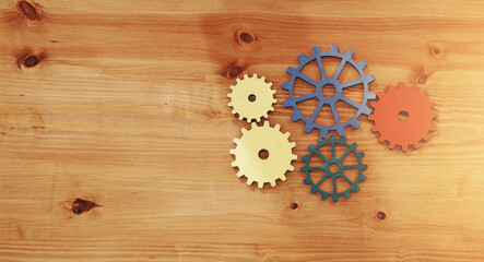 Above, gears and space on table for problem solving, planning and workflow in office. Business,...