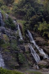 Siriphum Waterfall in Doi Inthanon, Chiang Mai, Thailand – tall mountain waterfall flowing through dense tropical forest in a serene natural setting.