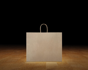 Large empty brown kraft paper bag isolated on wooden surface, black background.
