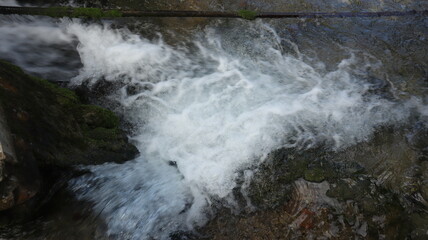 River flowing between rocks in the forest