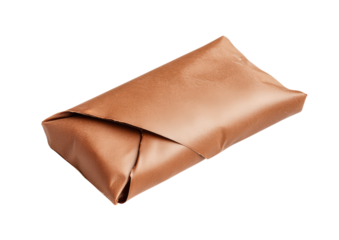 Sealed chocolate bar wrapper in warm copper foil with clean edge fold isolated on a transparent background