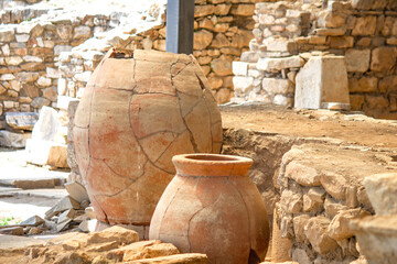 Fototapeta premium Earthenware jar in the ruins of the ancient city of Metropolis. Archeology. Clay vessel used to ferment wine in ancient times. No people, nobody. Horizontal photo.