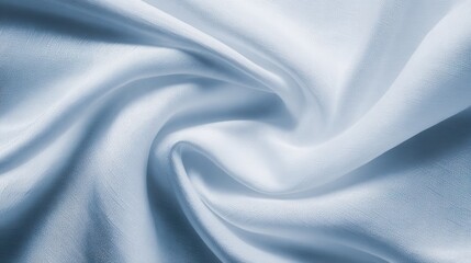 Smooth, light blue satin fabric draping elegantly, creating soft folds and textures