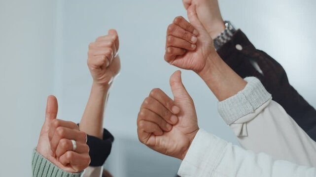 Business people, hands or thumbs up with team for good job, well done or agreement in office. Closeup, group or employees with like emoji, yes sign or OK for work cohesion or social feedback together