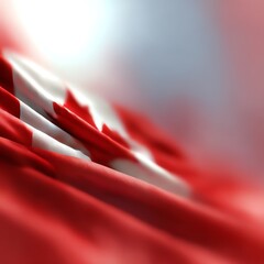 Canadian flag waving in the breeze, vibrant red and white colors.