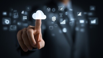 Hand pointing at floating icons of finance, analytics, and cloud computing above a dark background, innovation and success concept