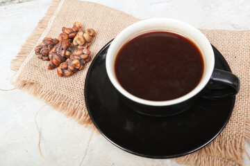 Kopi Luwak Coffee Bean or Civet coffee bean with Cup of Kopi Luwak coffee, world's most expensive coffee from indonesia