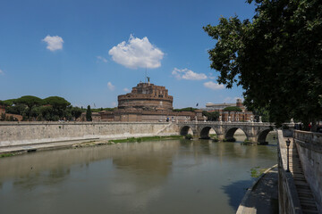 View from afar of the Castle and Sant'Angelo Bridge, with the River Tiver at its feet, on a sunny...