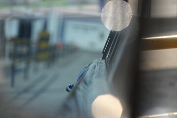 The inner door handles of a vintage car are captured in a clean view, reflecting the classic design...