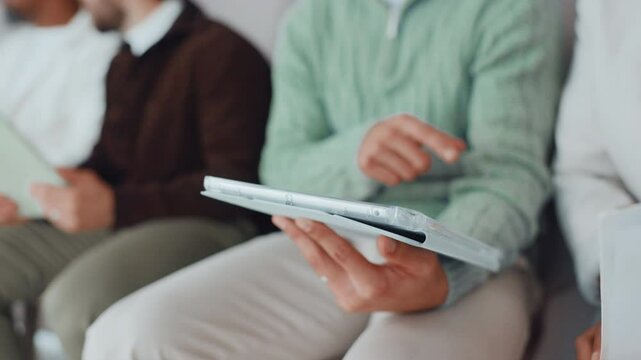 Group, hands and applicant with tablet, waiting room and practice for interview question or process. Row, candidate and people with tech for recruitment, conversation and planning for meeting and job