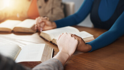 Hand holding, Bible and people praying with religion, guidance or support with scripture for...