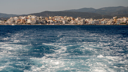 Vibrant coastal view of Agios Nikolaos in Crete Greece under a clear sky