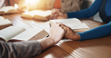 Hand holding, Bible and people with prayer for religion, guidance or support with scripture for...