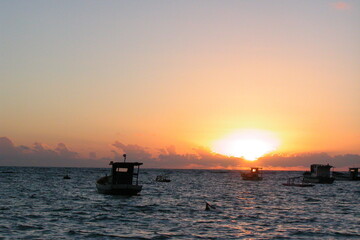 Boats on the water at sunset