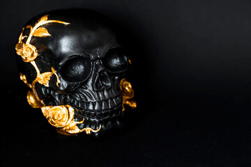 Halloween celebration. Black skull with golden roses on a black background. Decor for Day of the...