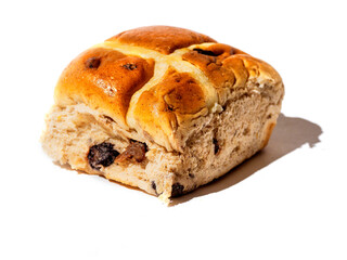 Fine cross bun on white background, hard lighting, Tasty bakery product. Popular traditional desert.