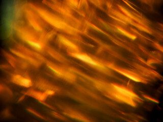 Colorful light leaks on black background for design and special effects. Retro film look. Abstract...