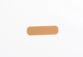 A single, unused adhesive bandage on a white background,  dressing,  detail