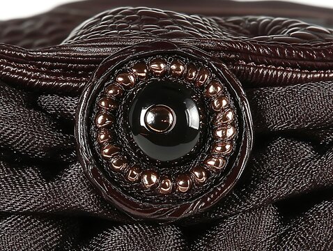 Elegant woven texture with decorative button, an emblem of sophistication