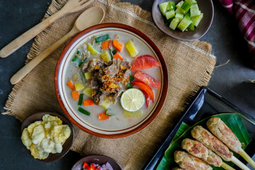 Soto Betawi is a traditional food from Jakarta, consisting of a mixture of coconut milk and milk sauce, meat, offal, carrots, potatoes, lime and spices.