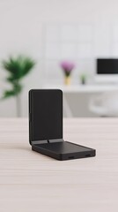 Black Foldable Smartphone Unfolding on Wooden Desk