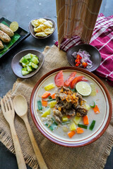 Soto Betawi is a traditional food from Jakarta, consisting of a mixture of coconut milk and milk sauce, meat, offal, carrots, potatoes, lime and spices.