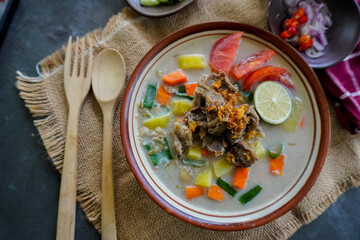 Soto Betawi is a traditional food from Jakarta, consisting of a mixture of coconut milk and milk sauce, meat, offal, carrots, potatoes, lime and spices.