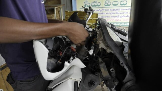 Expert Hand at Work - Troubleshooting Electrical Components