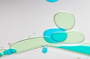 Abstract Close-Up of Colorful Liquid Bubbles on a Clear Surface