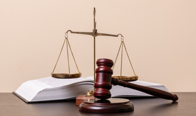 The scales of justice, the judge's gavel and an open book