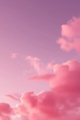 Fototapeta premium Dreamy cotton candy clouds float across magical pink-purple evening atmosphere.