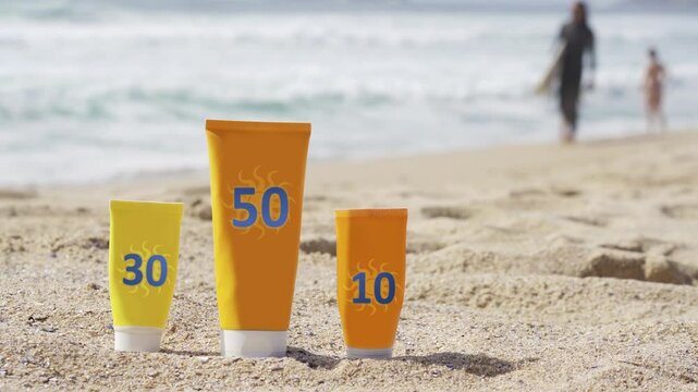 sunscreen sunblock  sun screen protection cream with spf level  on shore beach with waves in background , 4k video footage closeup