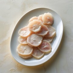 Chikuwa fish cakes sliced on white oval plate
