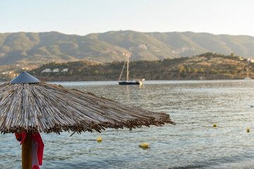 beach with umbrellas, Poros, Greece