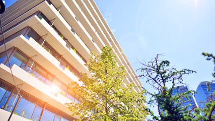 Office with green environment. Corporate building reduce CO2. Sustainable glass office building...