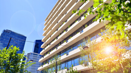 Office with green environment. Corporate building reduce CO2. Sustainable glass office building...