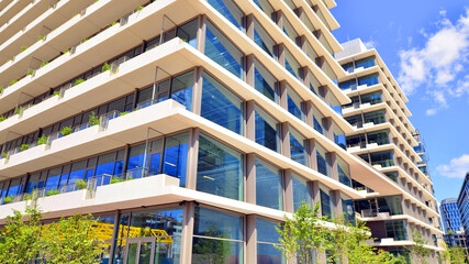 Office with green environment. Corporate building reduce CO2. Sustainable glass office building...