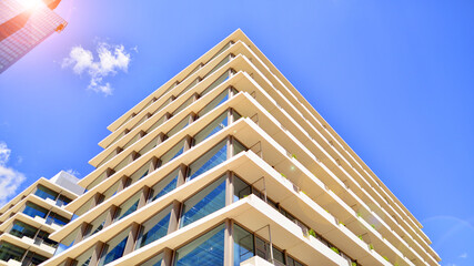 Modern office building with glass facade. Transparent glass wall of office building. Reflection of...