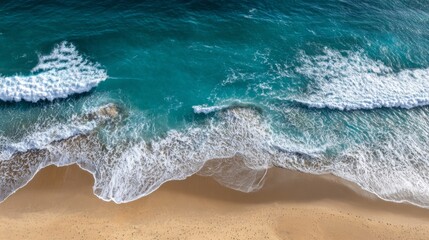Aerial view of ocean waves breaking on sandy beach Turquoise water white foam