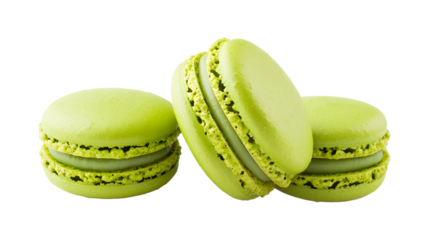 Three green macarons are sitting on a white background