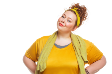 Confident plus size woman in yellow outfit smiling with hands on hips isolated on transparent png background