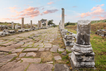 Scenic view of the ancient roman road with columns leading to the ruins of Asclepion in Pergamon at...