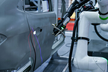 3D scanner on robotic arm measure the accuracy of automotive parts. in industrial plants