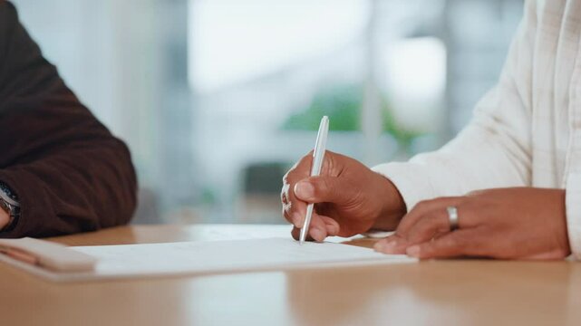 Agreement, pointing and signature with handshake of business people in office for contract or deal. Documents, hiring and recruitment with employee shaking hands in workplace for bonus or promotion