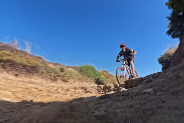 Mountain biker riding a bike