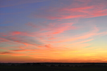 Vibrant Sunset with Pink and Orange Clouds wallpaper
