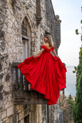 Red Dress Woman Castle Balcony: Photo Shoot, Medieval Architecture, Coastal View.