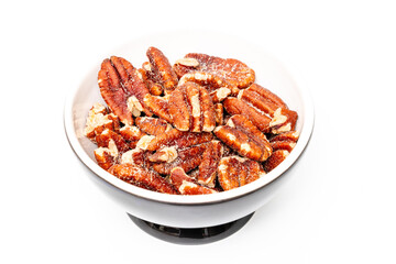 Pecan nut isolated. Pecan nuts are a rich source of energy and contain lots of nutritional benefits. Toasted pecans.