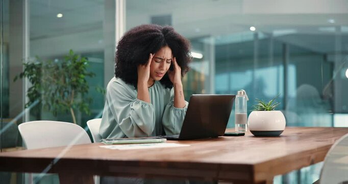 Woman, headache and tired with laptop in office for finance review, exhausted or vertigo at company. African person, document and stress for migraine, fatigue or burnout with pc at corporate agency