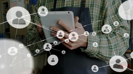 craftsman tapping tablet screen and growing animated user network for workshop tech visualization - Powered by Adobe